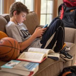 Teenager absorbed in phone